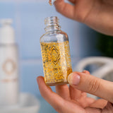 Closeup of 24K Gold Face Serum With Droplet